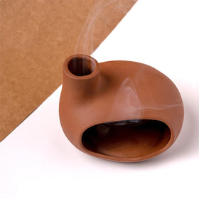 MOUGIGI Terracotta Palo Santo Holder makes a mindful gift for meditators.