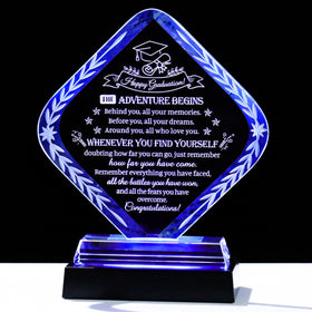 Movdyka crystal graduation plaque in rhombus shape with light base reflecting pride and achievement.