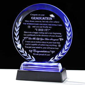 Movdyka graduation crystal plaque round glows softly for display.
