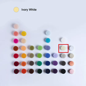 MOZEAL ivory pillar closeup, dripless design ensures tidy surfaces and minimal wax mess.