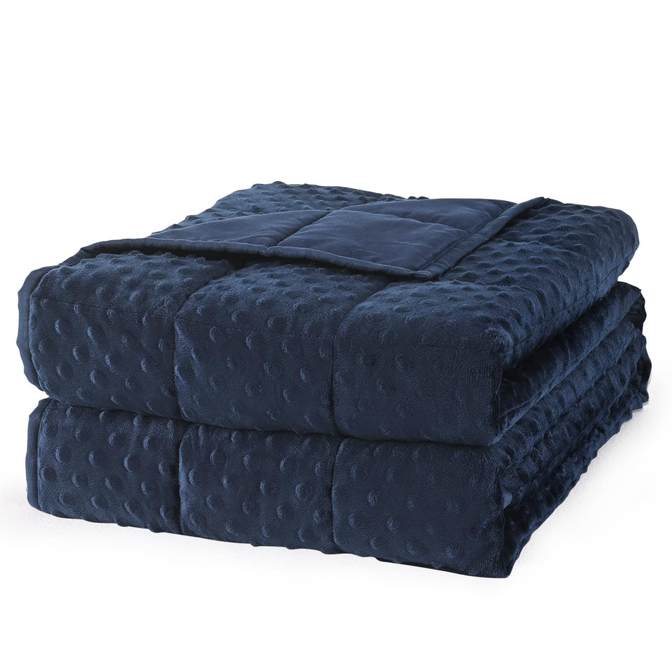 Mr. Sandman weighted blanket in navy blue draped for cozy evenings.