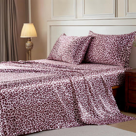 MR&HM satin sheets with elastic corner straps securing a slip-free fit on the mattress