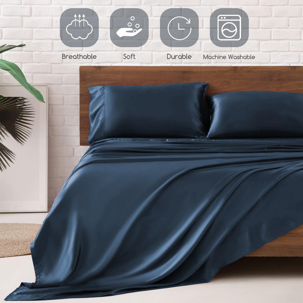 MR&HM mood indigo satin sheets styled on a bed for elegance.