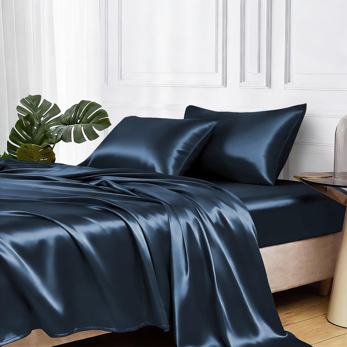 MR&HM satin sheets with elastic corner straps secure a snug fit on mood indigo queen bed.