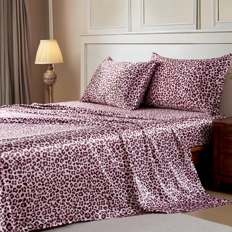 MR&HM satin sheets with elastic corner straps secure a queen bed for a slipping-free sleep.