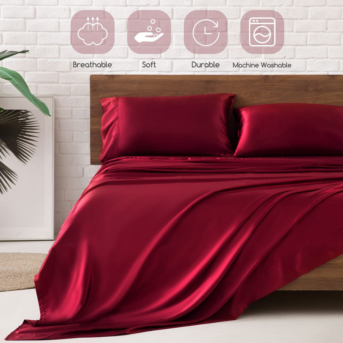 MR&HM burgundy bed scene with luxurious satin sheets for an elegant sleep space
