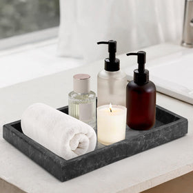 MULWR marble tray keeps cosmetics within reach with a refined look.