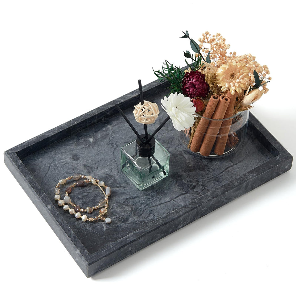 MULWR marble tray on vanity for organized cosmetics and jewelry.