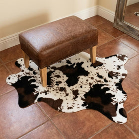 MustMat cow print rug used as party decor enhances space with flair