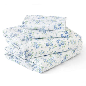 MUXHOMO blossoms light blue queen sheets on a bed for cool, breathable comfort.