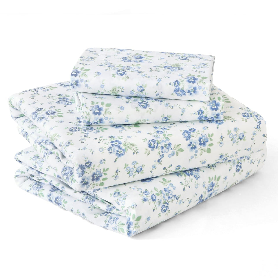 MUXHOMO blossoms light blue queen sheets on a bed for cool, breathable comfort.