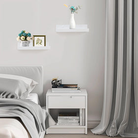 Muzilife living room display of photos and decor on wall ledges