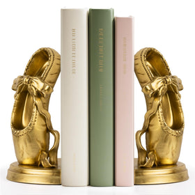 MXARLTR ballet slipper bookends in gold provide elegant support for shelves.