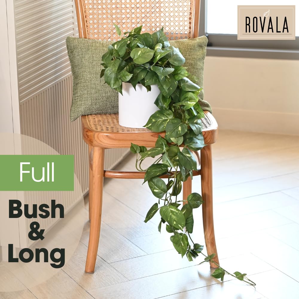 MY ROVALA silk plant in white pot adds easy, clean greenery to any room.