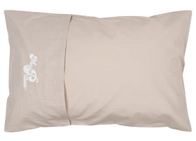 MyPillow travel pillow rolled up in its built-in case for easy packing.