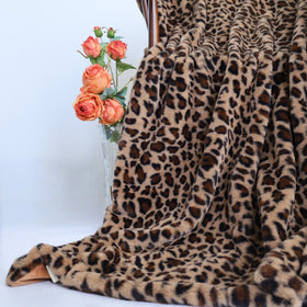 MYRU Velboa blanket on a chair demonstrates versatile movie-night use.