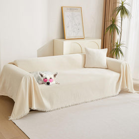 MYSKY HOME couch cover with tassels protecting a beige sofa from spills
