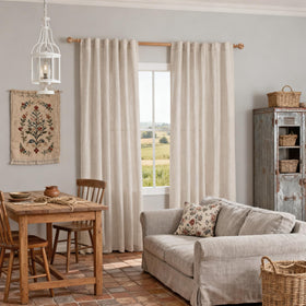 Natural color curtains with woven pattern complementing neutral interiors