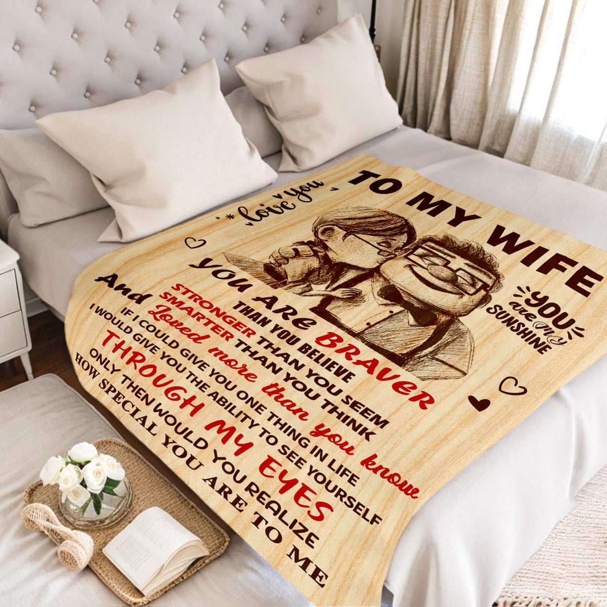 NAIREG anniversary gift blanket laid on bed showing premium material.