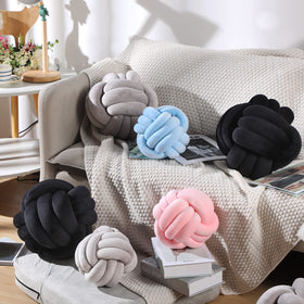 Namalu soft knot pillow ball black close-up reveals handcrafted cross-stitch details.
