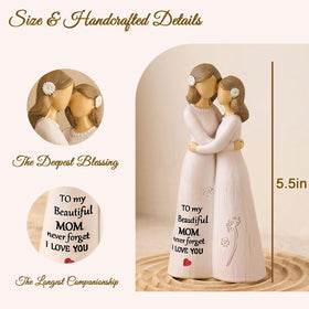 Mother and daughter embrace captured in cream tones for NAN ZAI NAN FANG figure.