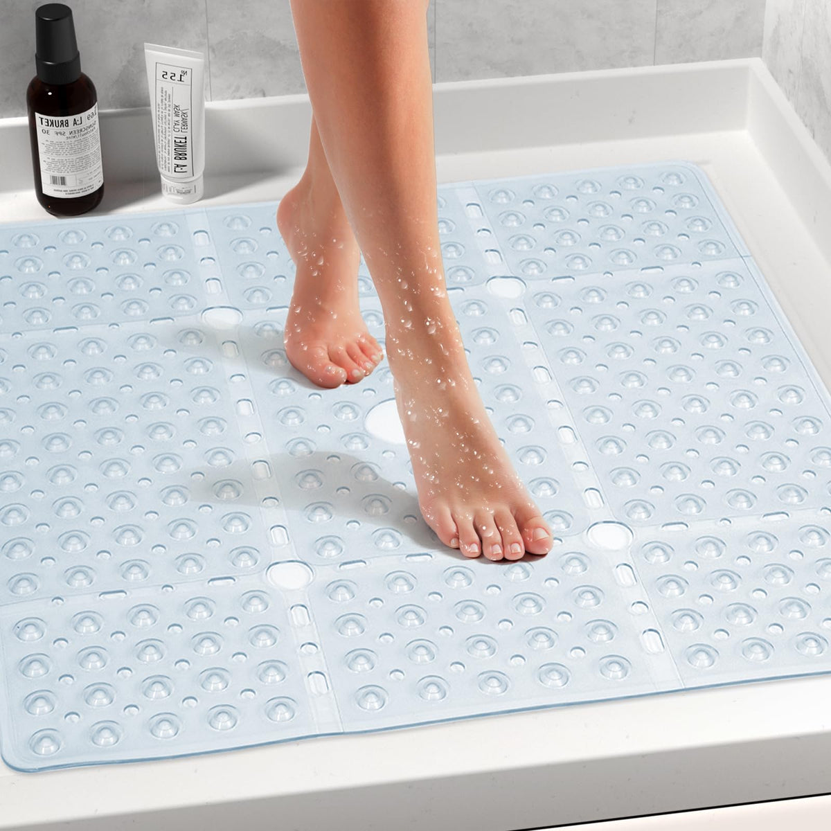 Naoloture shower mat showing drain holes for quick water drainage