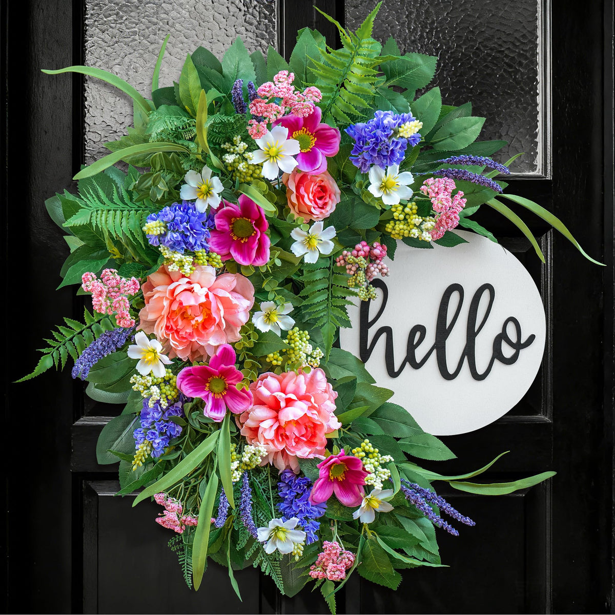 Naturawre 24-inch spring wreath on front door with Hello sign boosts curb appeal.