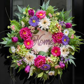 NaturaWre Spring Wreath with wooden Home sign brightens entryways.