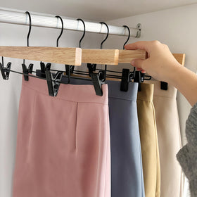 Natural varnish finish on Nature Smile hanger adds elegant protection for fabrics.