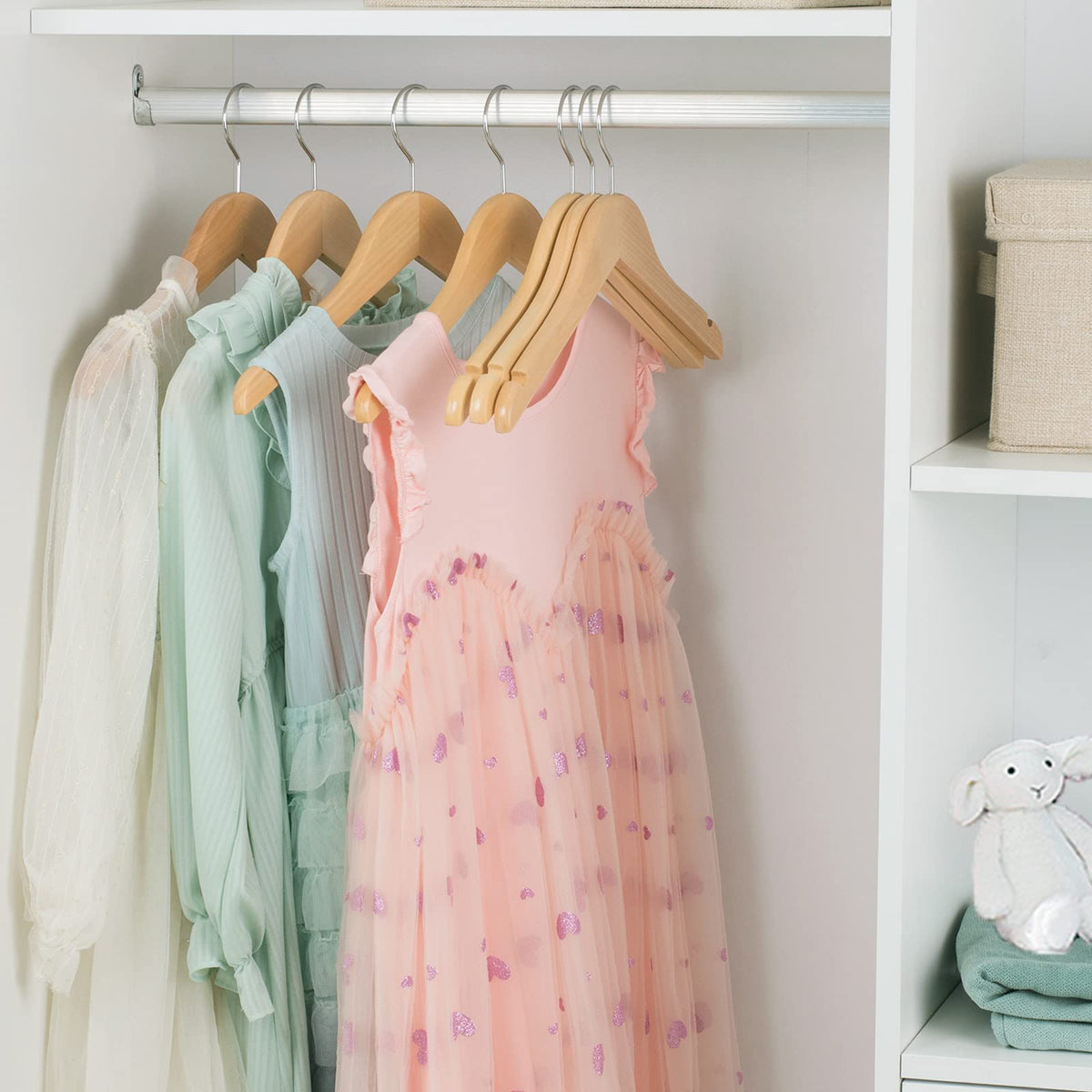 Nature Smile durable hangers support growing children's outerwear through seasons.