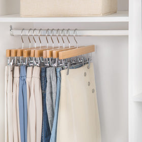 Nature Smile heavy-duty wood hanger supports pants and skirts securely.