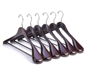 Nature Smile luxury mahogany suit hanger close-up showing rich finish and solid craftsmanship for keeping suits well-shaped