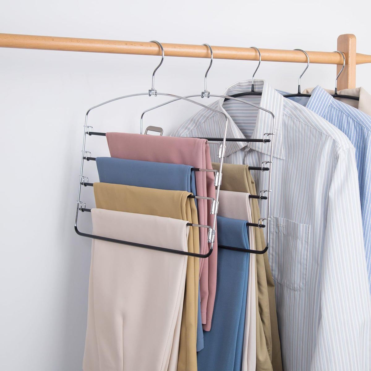 Nature Smile pants hanger with swing arms for convenient outfit selection.