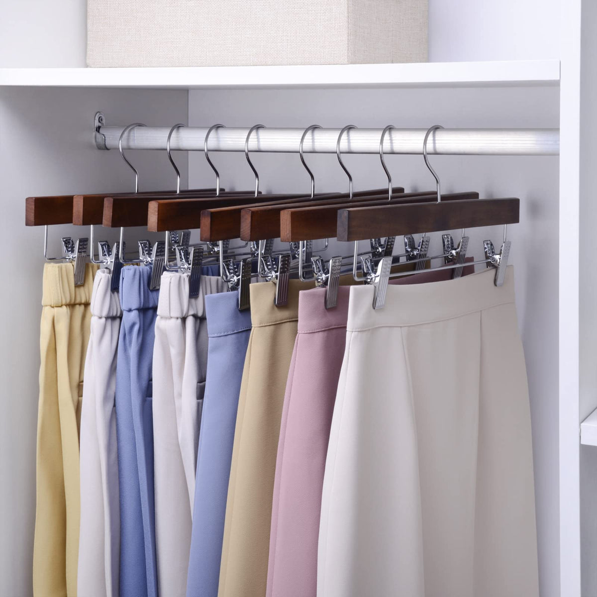 Nature Smile lotus wood hanger with non-slip clips keeps skirts securely in place.