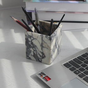 Natust holder used for makeup brushes, blends with elegant marble look