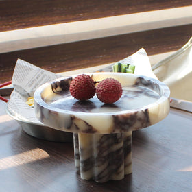 Natust marble catchall tray on an entryway table simplifies arrivals.