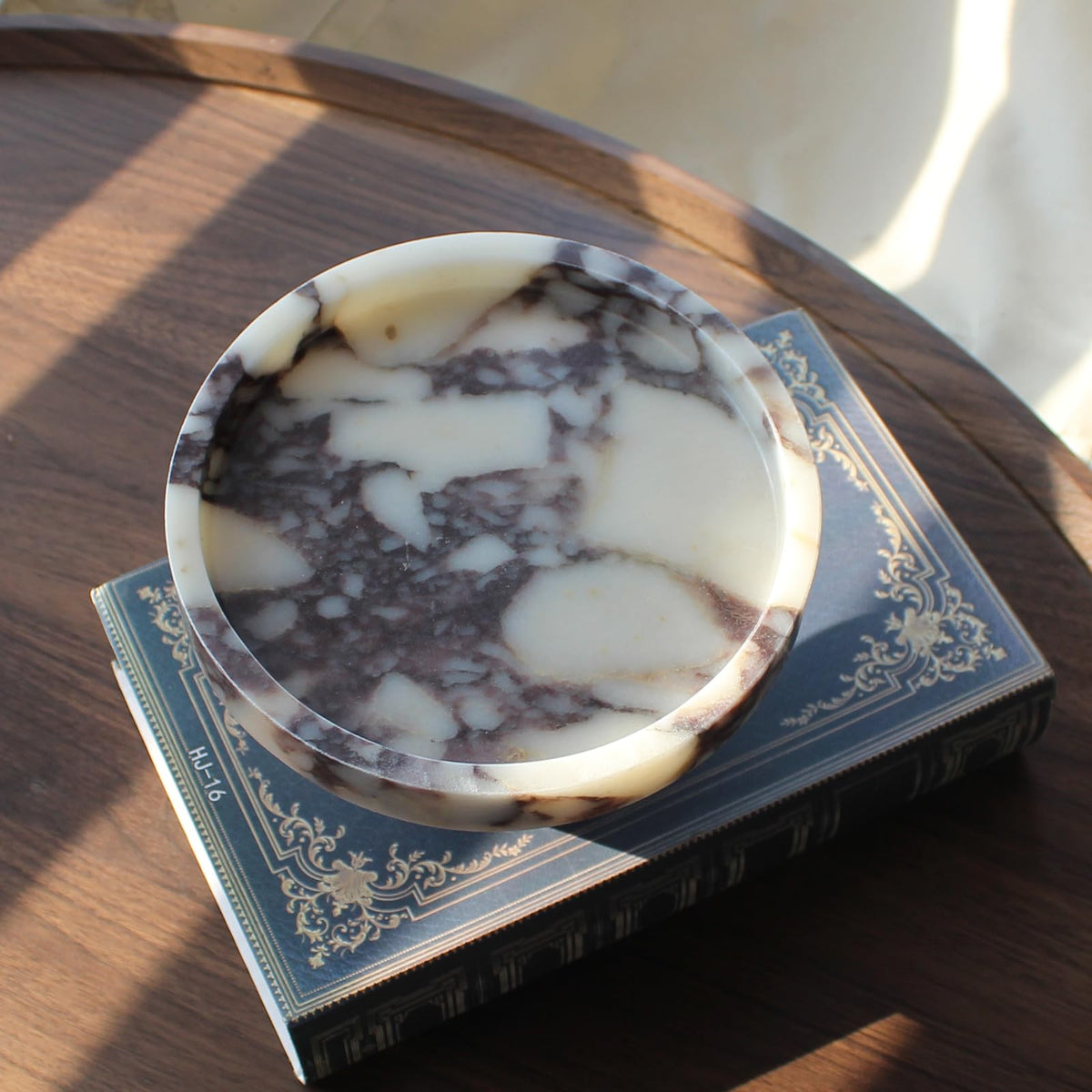 Natust jewelry and perfume dish keeps daily essentials within easy reach.