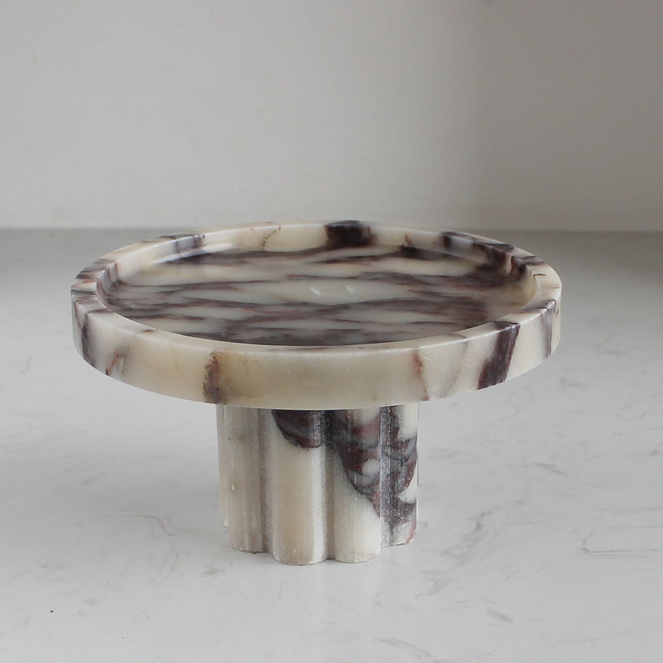 Natust natural marble tray with legs on vanity keeps accessories neatly organized.