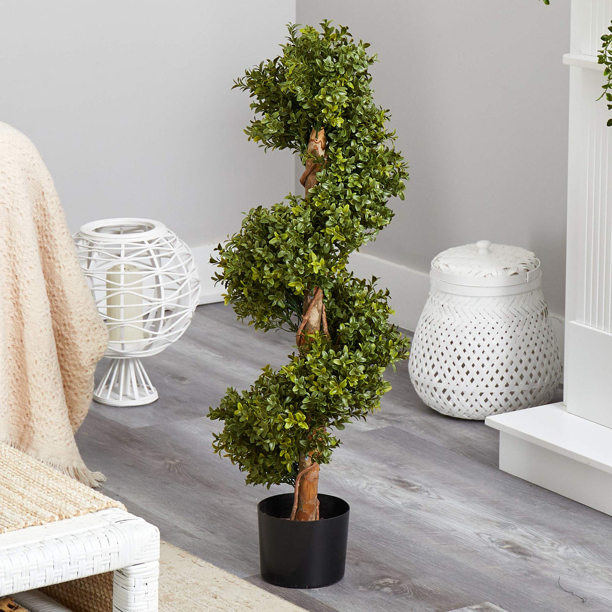 Nearly Natural spiral topiary shows dense texture for professional-looking spaces.
