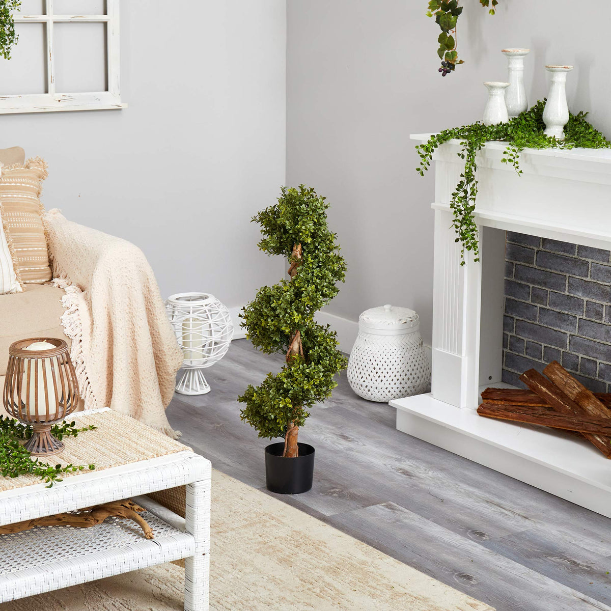 Nearly Natural indoor/outdoor topiary adds vertical interest in foyers and offices.