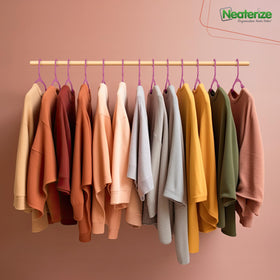 NEATERIZE eco-friendly plastic hanger with reinforced edges for durability.
