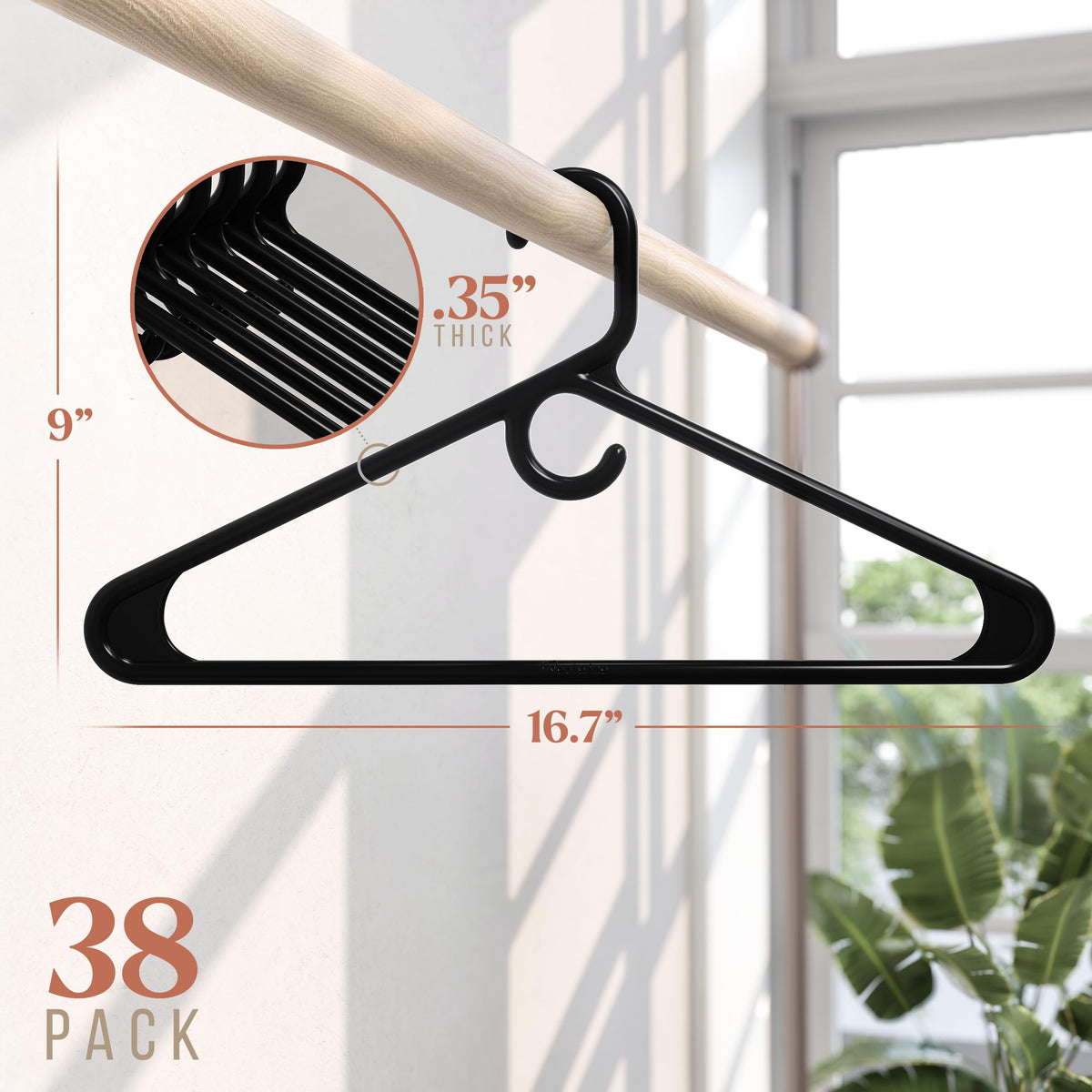 Close-up of reinforced bottom bar on NEATERIZE hangers showing added support.