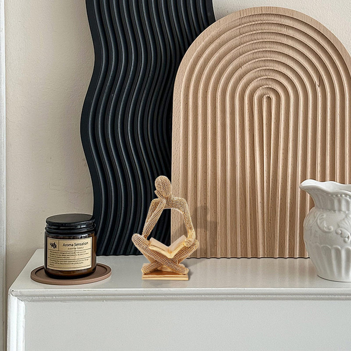 Neeenn Sparkling Gold resin sculpture, durable finish that resists tarnish.