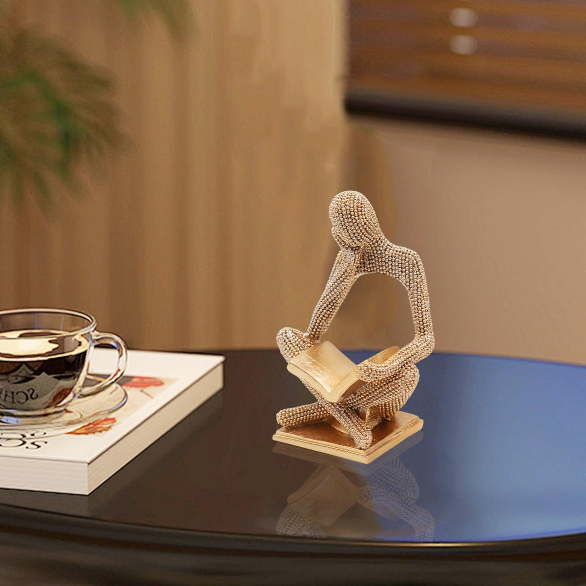 Neeenn Sparkling Gold Reading Woman makes a thoughtful gift for art lovers.
