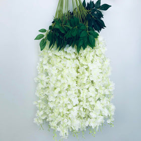 Cream-white wisteria hanging vine ideal for outdoor and indoor decor.