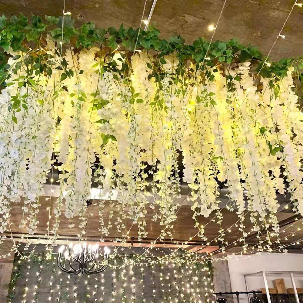 Realistic silk petals on a dense wisteria garland for decor.