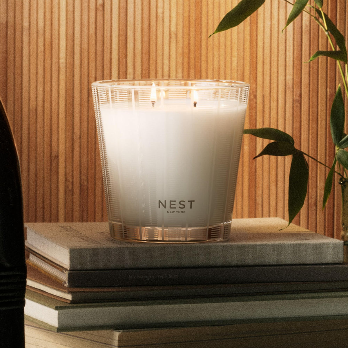 Nest New York Bamboo 3-Wick Candle featuring floral-citrus bouquet fills rooms with fresh notes.