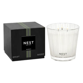 Nest New York Bamboo 3-Wick Candle in glass vessel enhances spaces with refined fragrance.