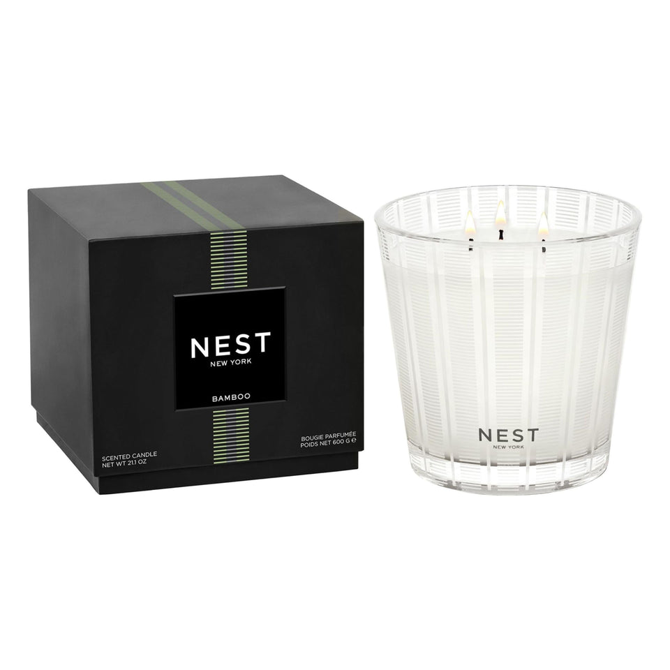 Nest New York Bamboo 3-Wick Candle in glass vessel enhances spaces with refined fragrance.