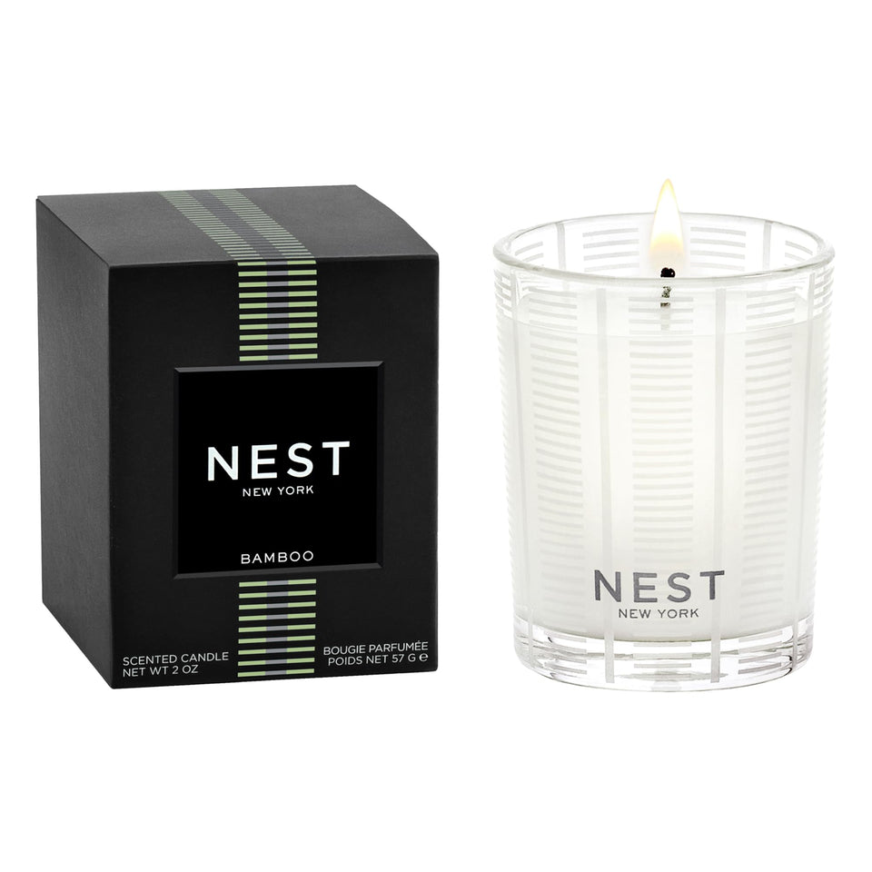 Nest New York Bamboo votive in a reusable frosted-glass vessel for elegant ambiance.